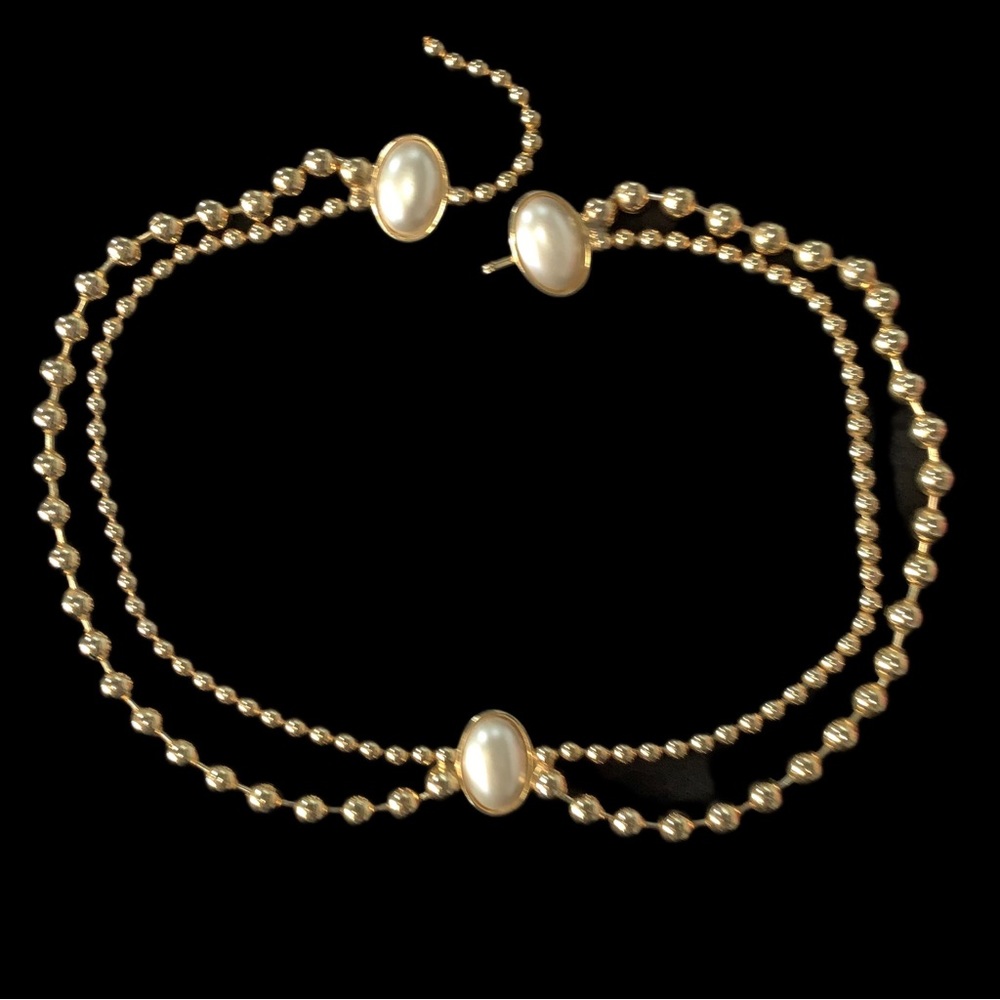 Belt of Pearl and Gold. Loop it through jeans. Accent that black Suit or Jumper